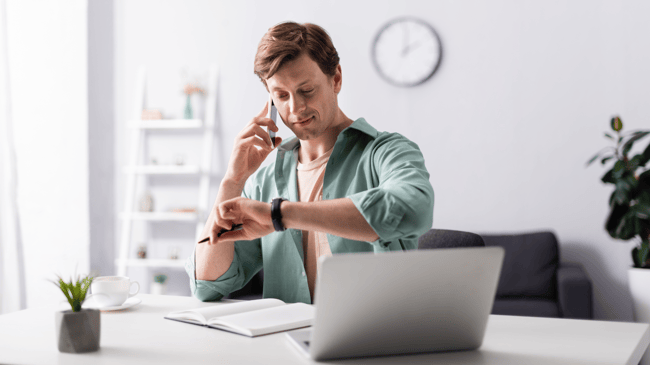 a man looking at his watch