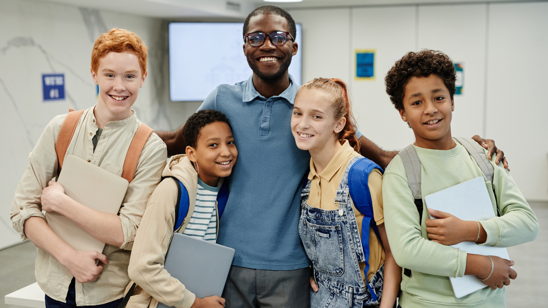 kids-embracing-teacher-2021-12-16-21-43-39-utc