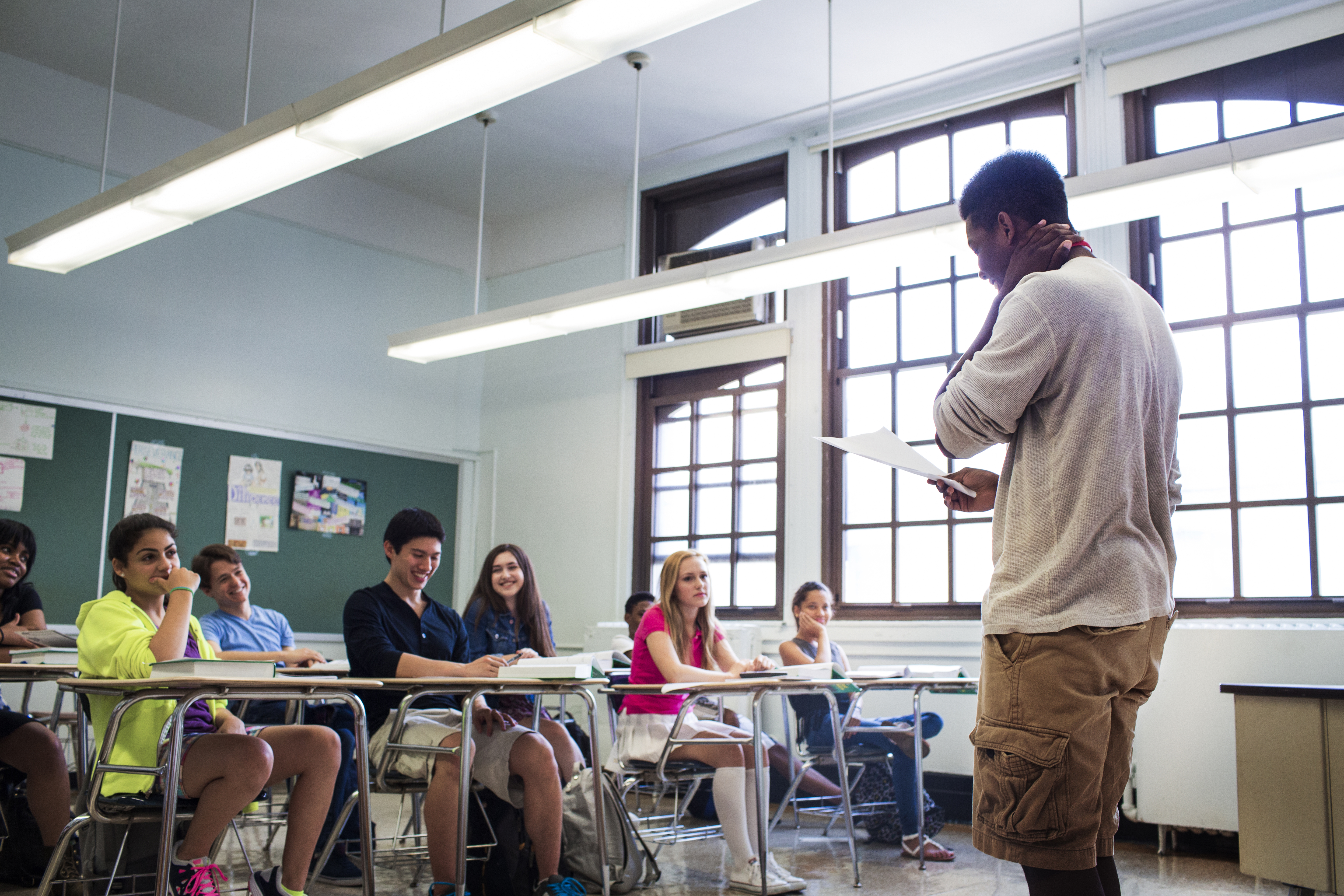 students-looking-at-teenage-boy-reading-notes-in-c-2022-03-09-02-30-24-utc