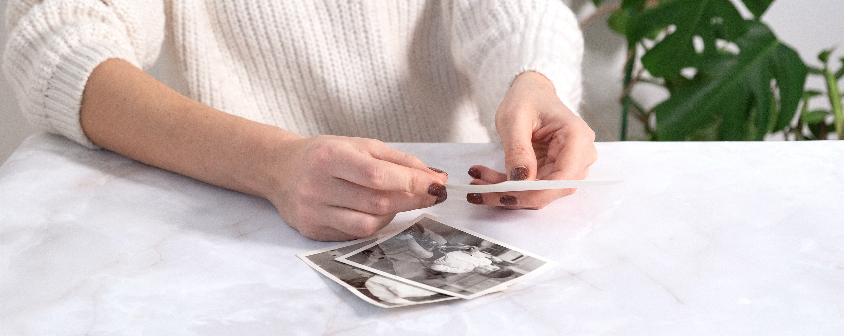 school faculty member looking at old photos for school video